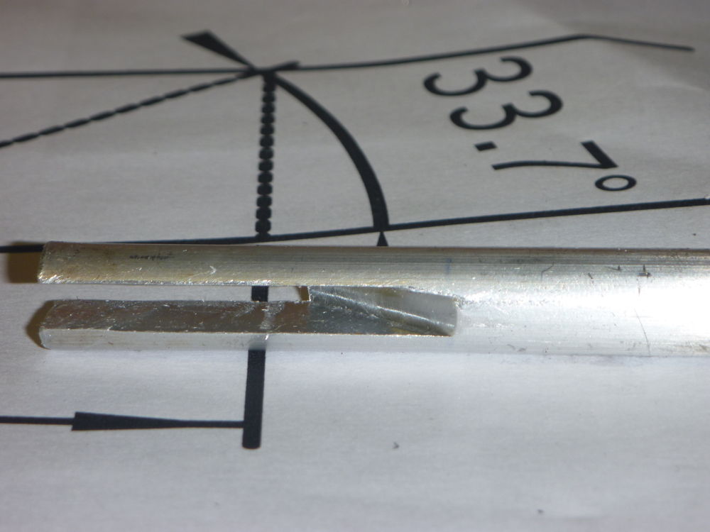 angled slot in door bolt pushrod